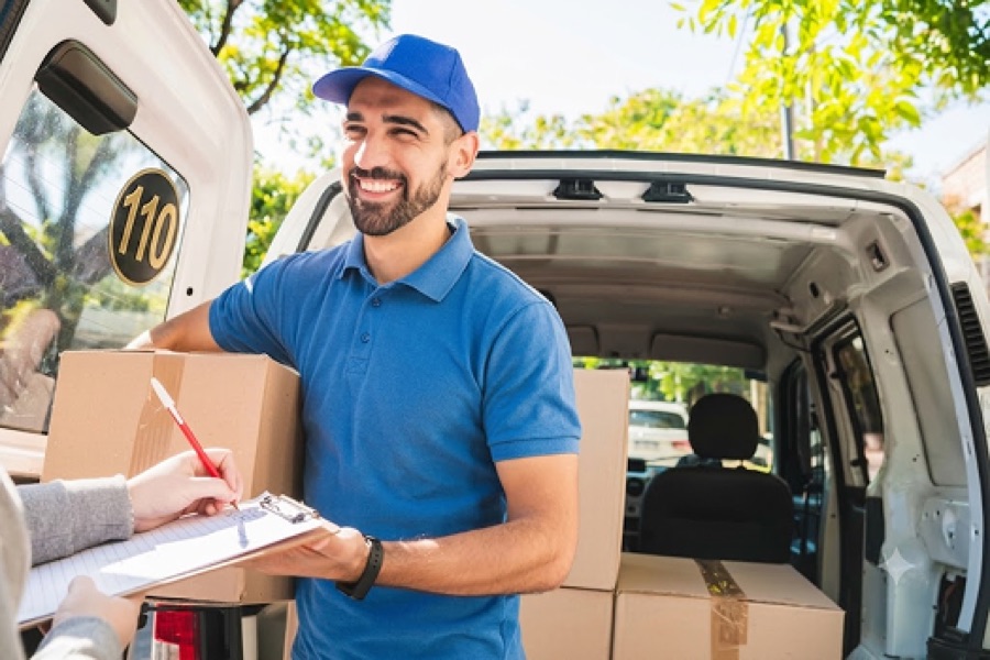 A local services business owner taking an order at the van